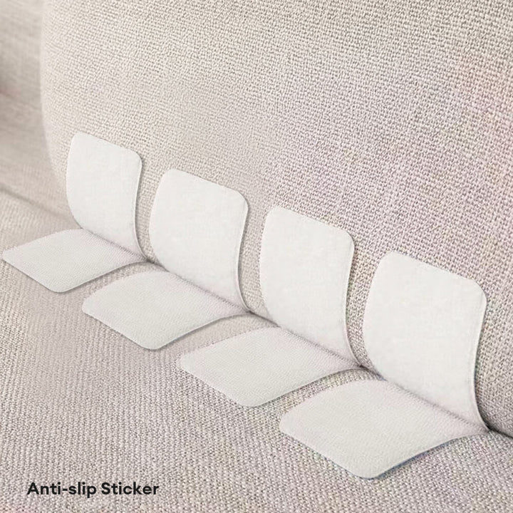 Anti-slip gripper stickers securing a couch cover, preventing movement and protecting furniture.