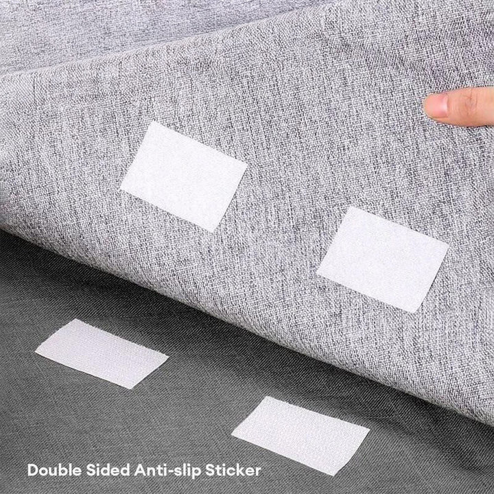 Pet-friendly anti-slip grippers providing firm hold for a couch cover on a sofa.