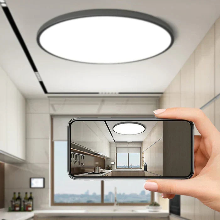 Elegant AuraSphere flat LED ceiling light for dining rooms, offering bright, energy-saving illumination.
