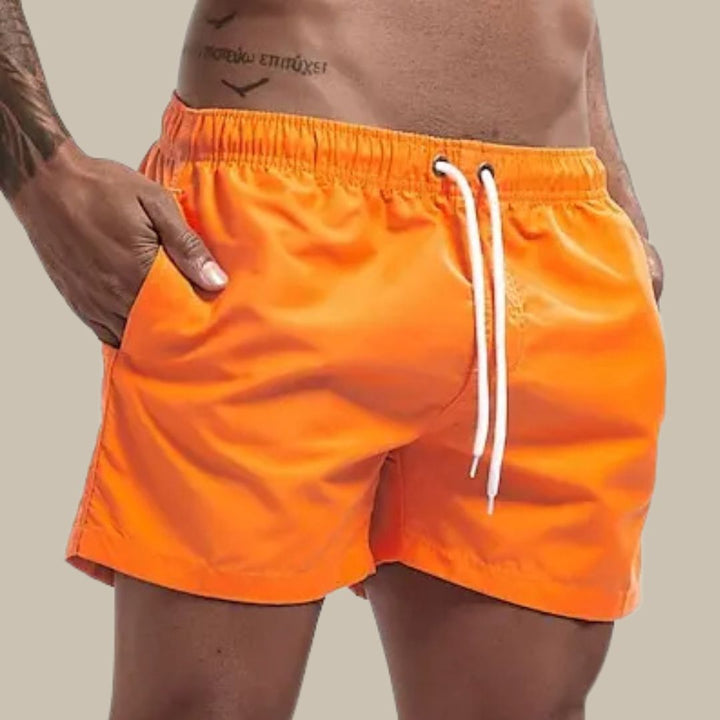 Relaxed fit men's above-knee swim shorts, quick-dry beachwear for summer comfort.