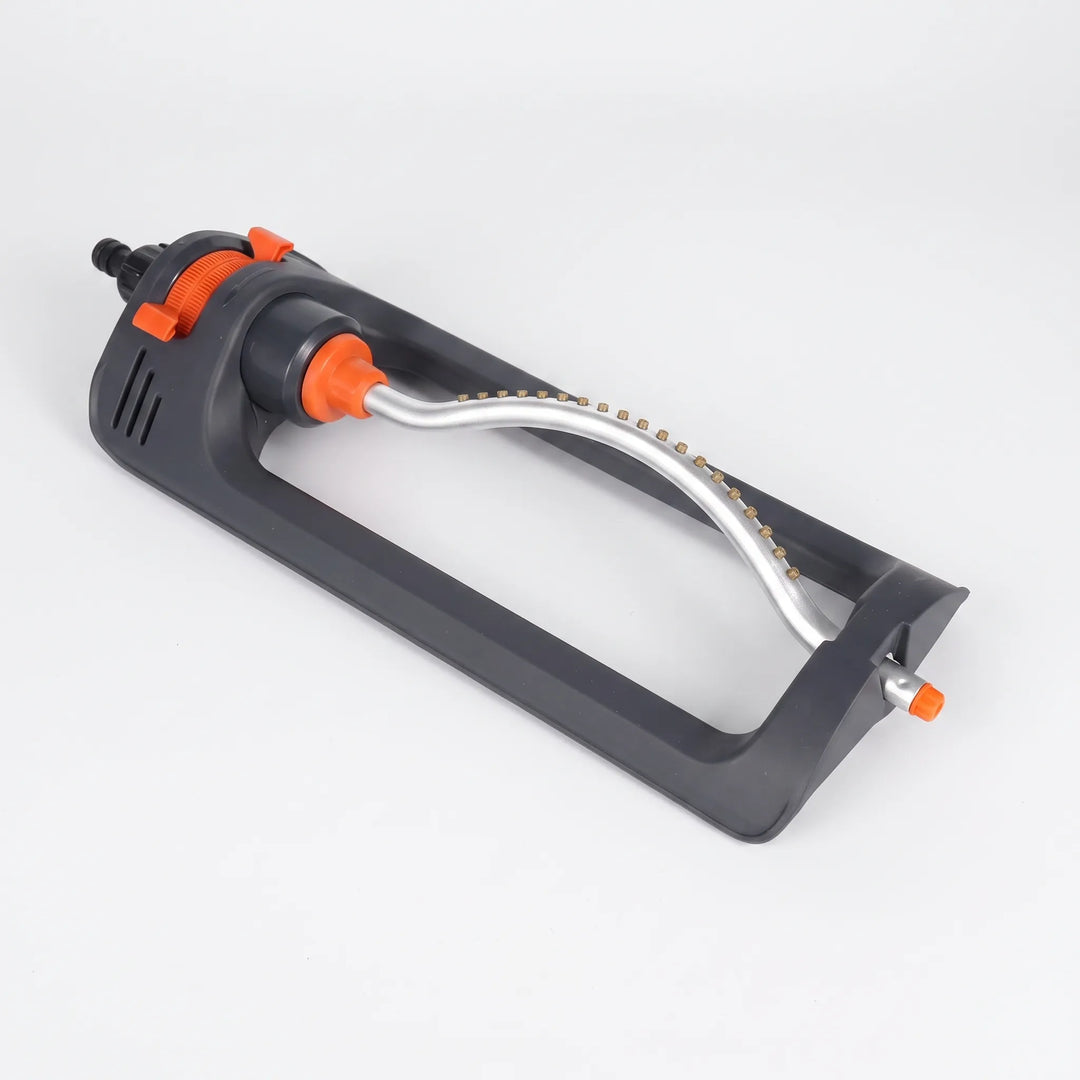 Adjustable automatic oscillating lawn sprinkler providing even water coverage across a large garden area.