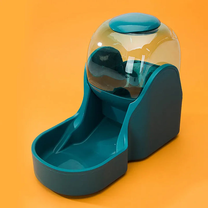 Gravity feed green pet dispenser with clear reservoirs for food and water, durable plastic construction