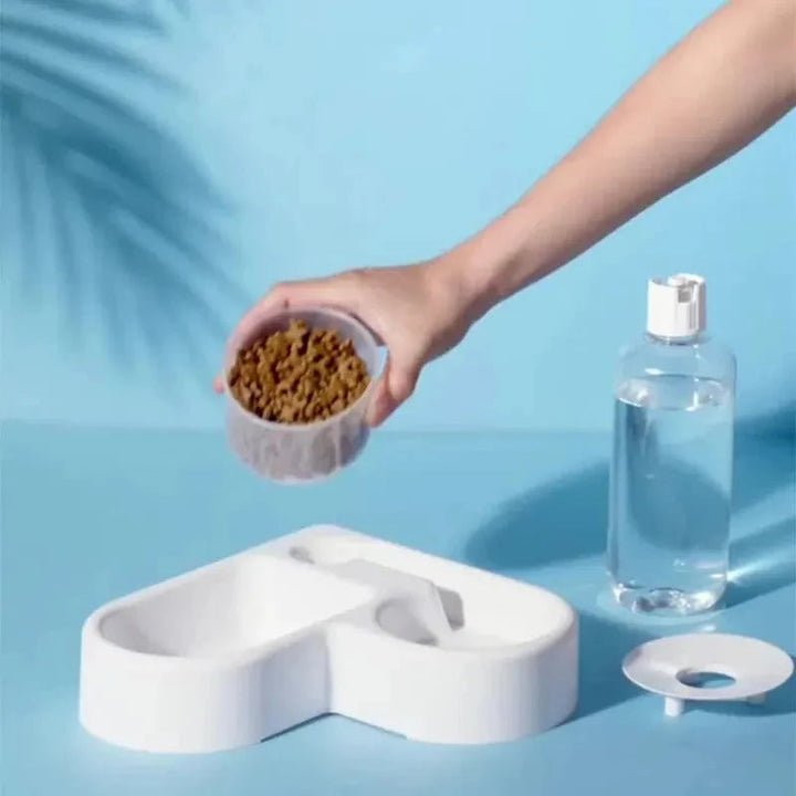 Durable automatic feeder with separate bowls for pet food and water, easy to clean gravity dispenser.