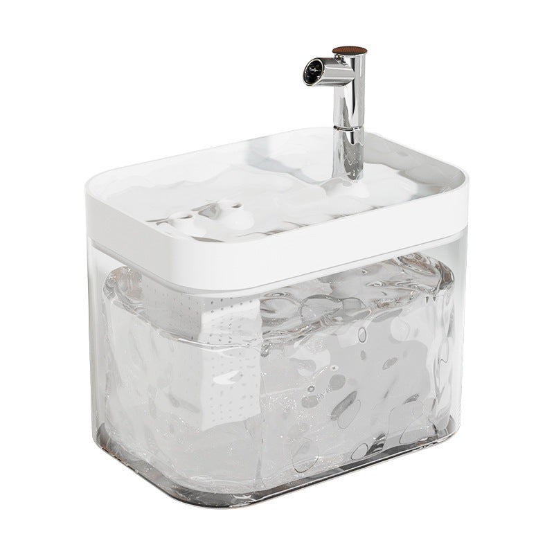 Top-down view of an automatic pet water fountain with visible water flow and filtration components.