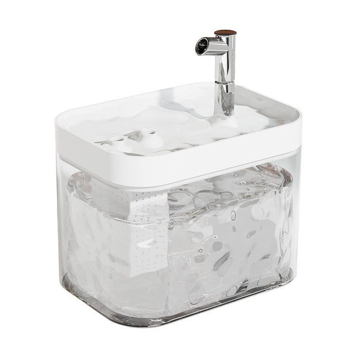 Top-down view of an automatic pet water fountain with visible water flow and filtration components.