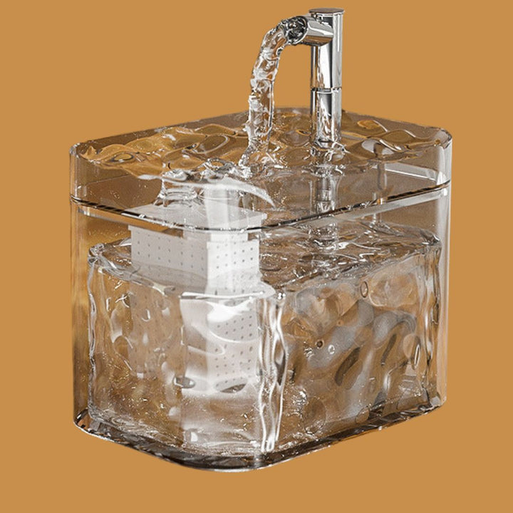 Automatic pet water dispenser alongside a food bowl, creating a complete pet care station.