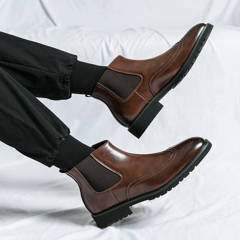 Everyday wear men's chelsea boots, comfortable slip-on style and refined brogue details.