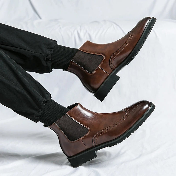 Everyday wear men's chelsea boots, comfortable slip-on style and refined brogue details.