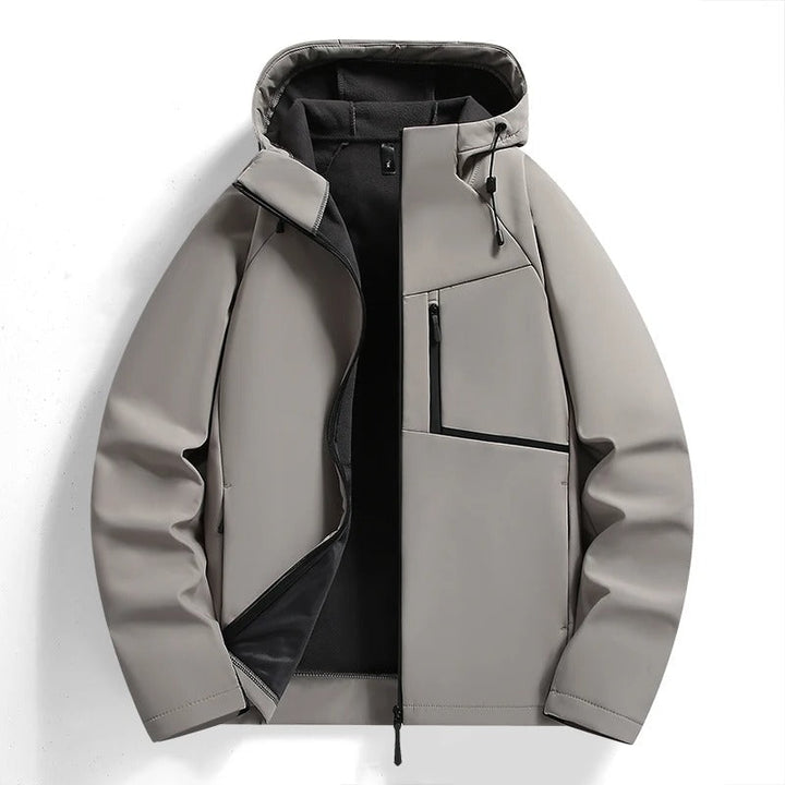 Stylish men's full-zip hooded jacket in a casual setting, comfortable & weather-ready outerwear.