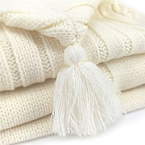 Full view of the Baby's Cozy Comfort Wrap, a soft beige acrylic newborn swaddle blanket with a gentle hood.
