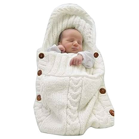 Gentle beige baby wrap for newborns, an acrylic infant blanket designed for cozy comfort and easy swaddling.