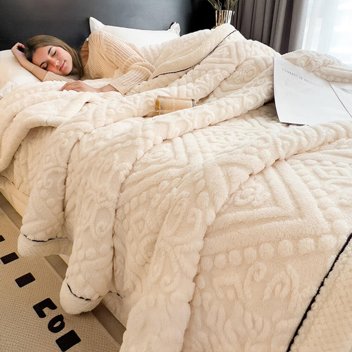 Corner detail of a Baroque embossed milk velvet fleece blanket, high-quality soft fabric