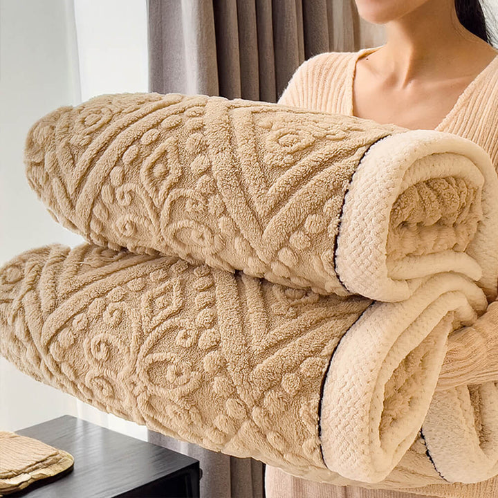 Baroque milk velvet fleece blanket draped over an armchair, providing warmth and luxury