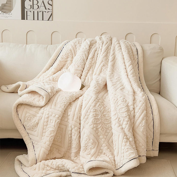 Milk velvet fleece blanket featuring detailed Baroque embossing, a cozy and stylish throw