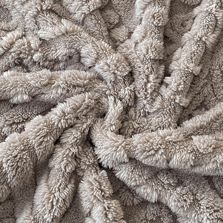 Close-up of soft milk velvet fitted sheet featuring elegant baroque embossed pattern. Premium bedding accessory.