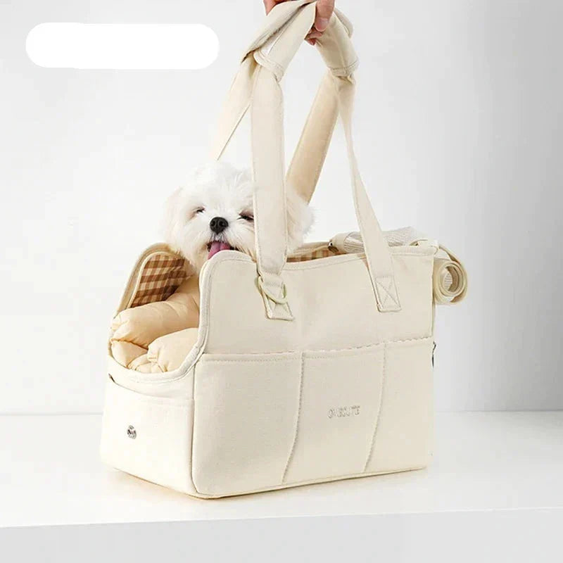 Lightweight dog carrier in beige, perfect for small pets on the go.