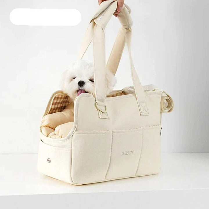 Lightweight dog carrier in beige, perfect for small pets on the go.