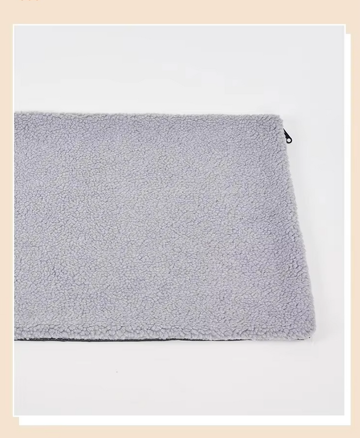Versatile beige self-warming pet blanket easily fitting in a cat or dog bed, washable care