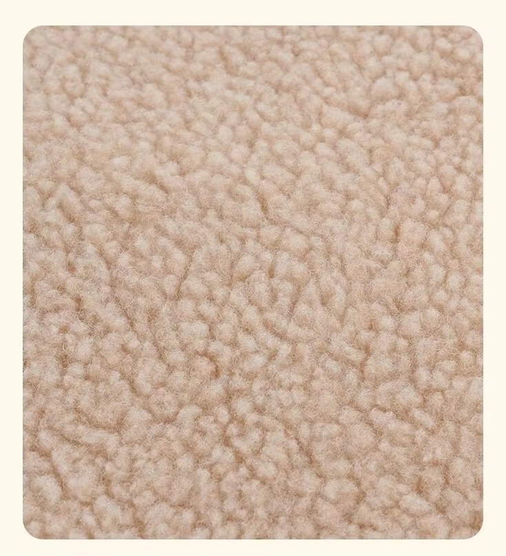 Close-up of plush beige self-warming pet blanket texture, ideal for cat and dog comfort