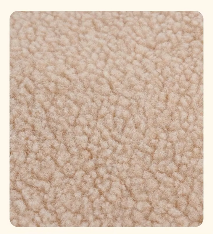 Close-up of plush beige self-warming pet blanket texture, ideal for cat and dog comfort