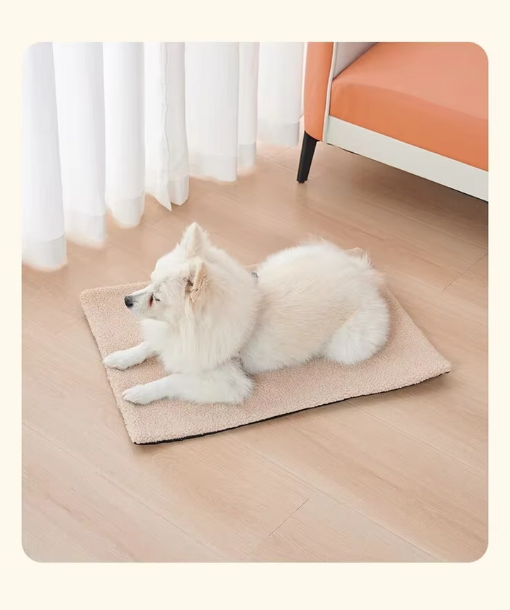 Folded beige self-warming pet blanket, ready for cozy cat or dog bed use, machine washable