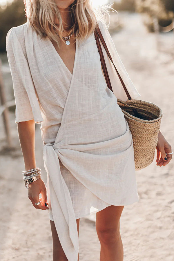 Beige Women's V-Neck Tie Waist Short Sleeve Wrap Mini Dress. Ideal for summer casual or beach wear.