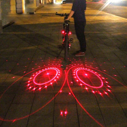 Bright bicycle laser light & LED rear light for superior road safety and visibility during night riding.