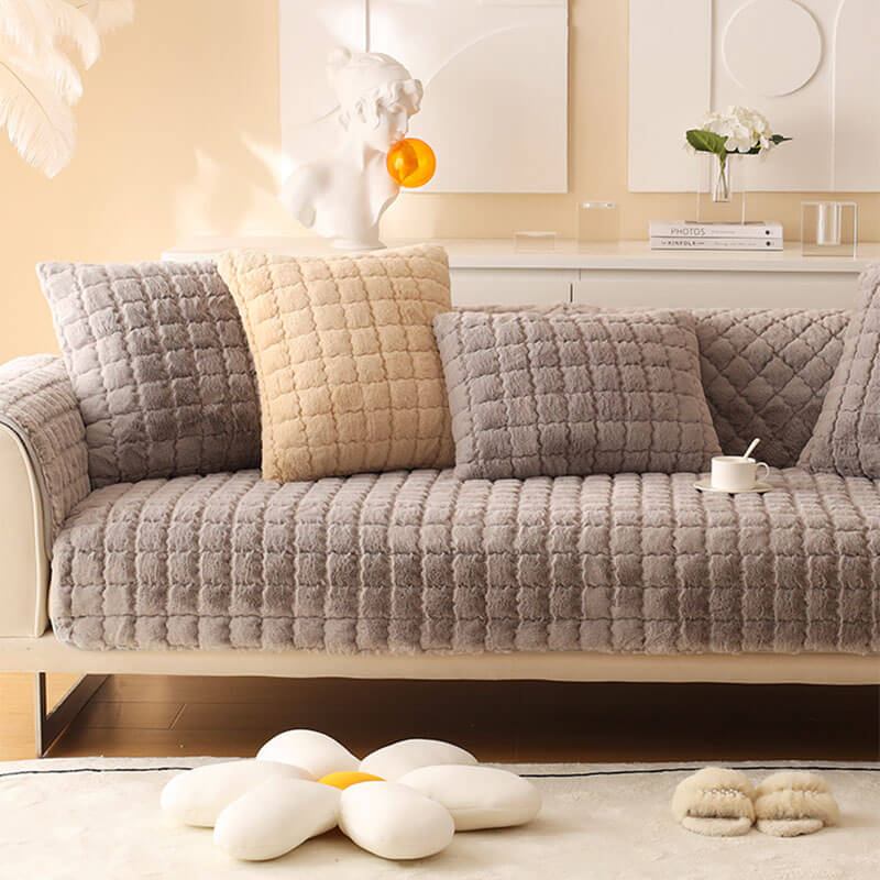 Biscuit plush non-slip couch cover showcasing its full length on a large sofa, comfy