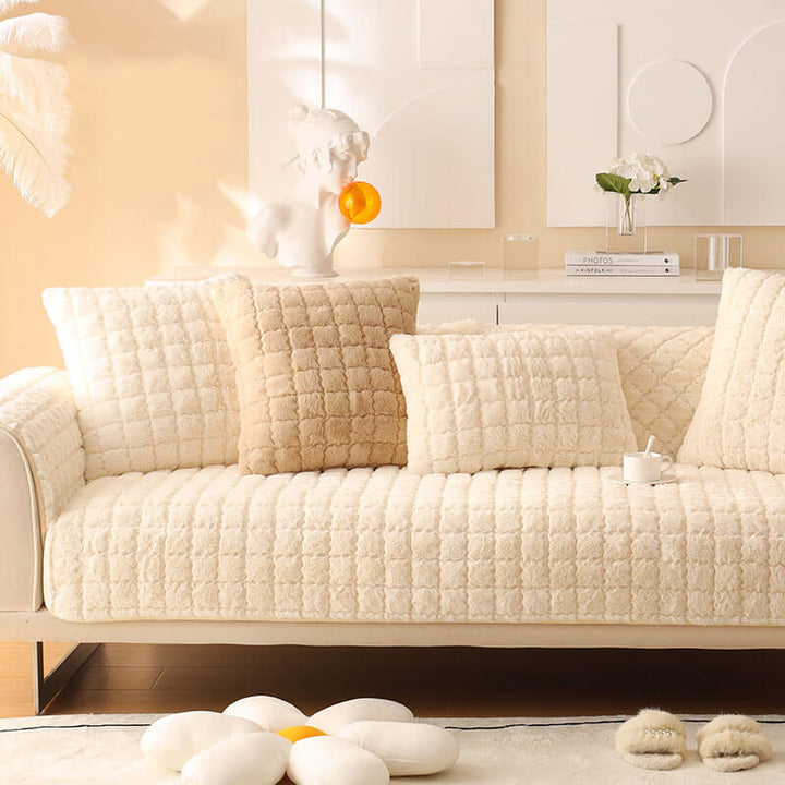 Detailed view of the non-slip backing on the biscuit plush couch protector, comfy