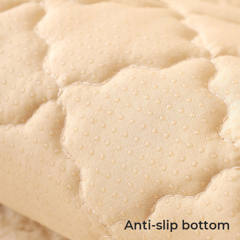 An empty living room with a biscuit plush non-slip couch cover neatly placed on sofa