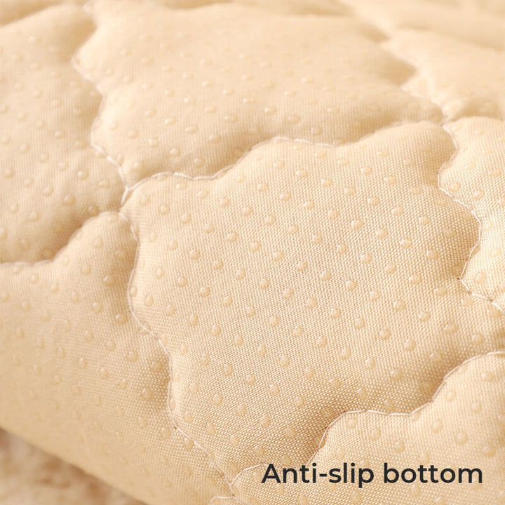 An empty living room with a biscuit plush non-slip couch cover neatly placed on sofa