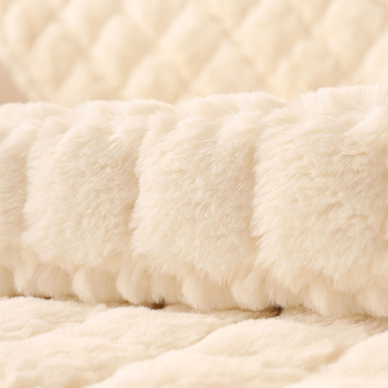 Biscuit plush non-slip sofa protector covering a corner sectional, elegant home decor