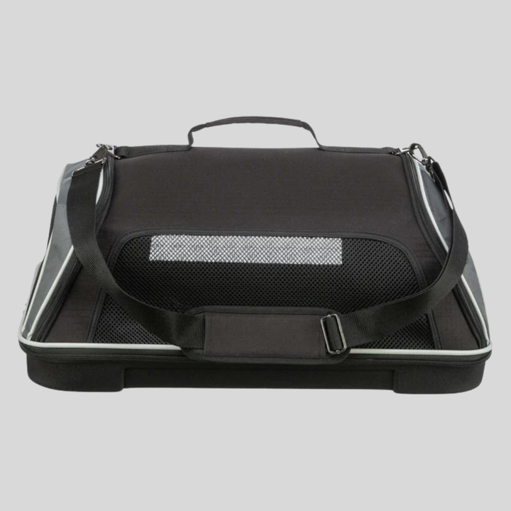 Foldable pet carrier with mesh windows and soft bedding, ideal for in-cabin airline travel.