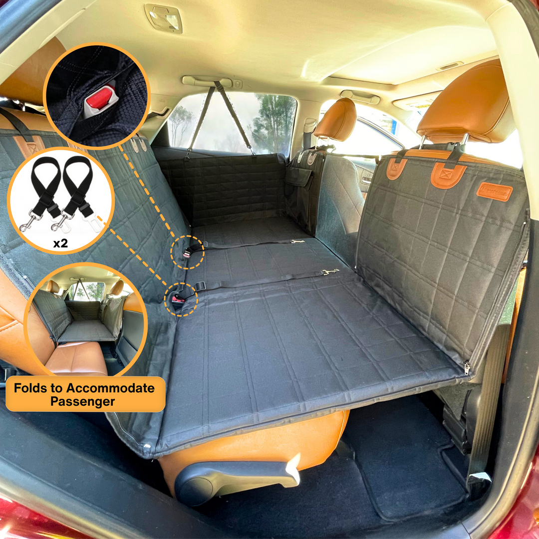 Waterproof black backseat protector for dogs, extends car floor & includes door covers. Ideal pet travel solution.