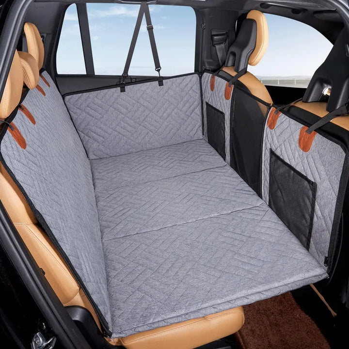 Durable dog car seat cover for back seat, pet travel gear with non-slip backing and side flaps.