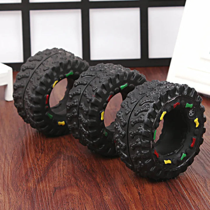 Pet accessory: tough black tire dog toy with dental nubs for effective teeth cleaning