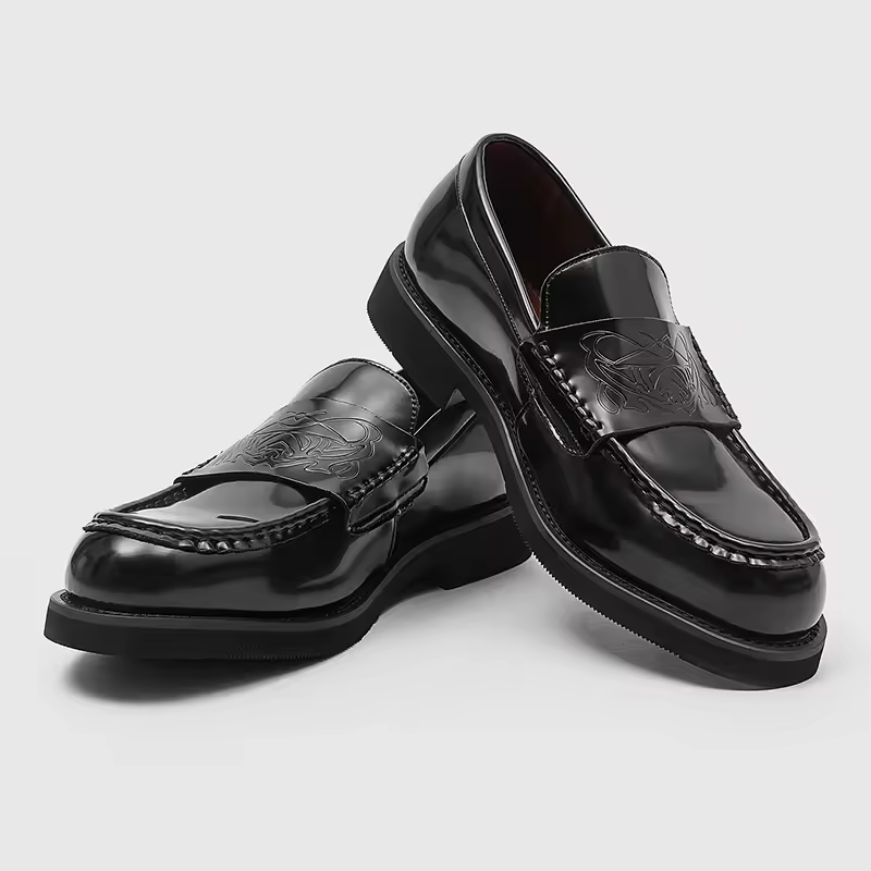 Black men's classic slip-on loafers for elegant, refined style. Perfect for formal or business casual wear.