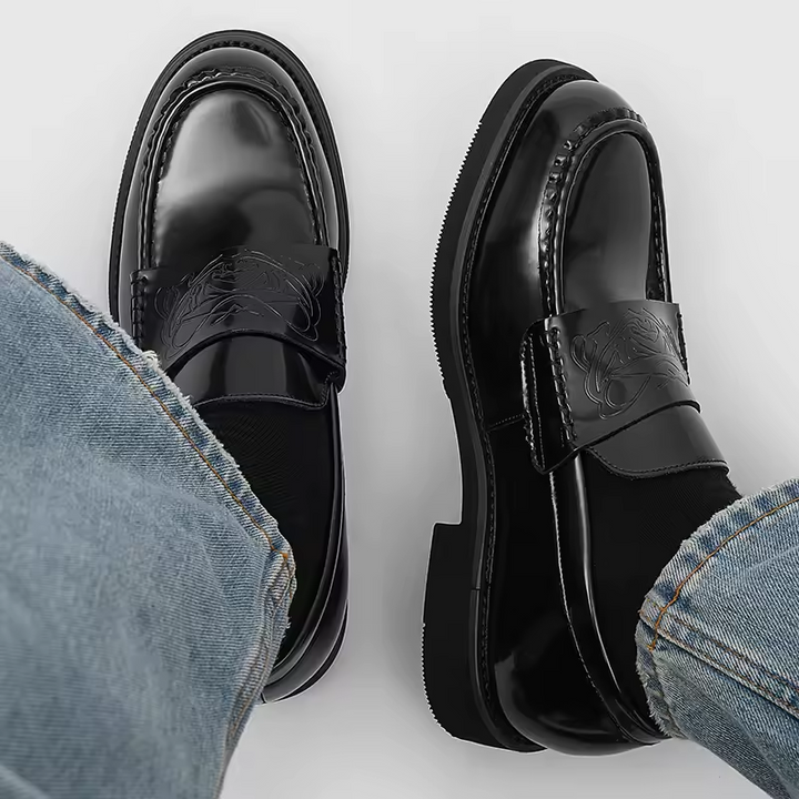 Elegant black slip-on dress shoes for men, ideal for formal events, business casual, or refined fashion.
