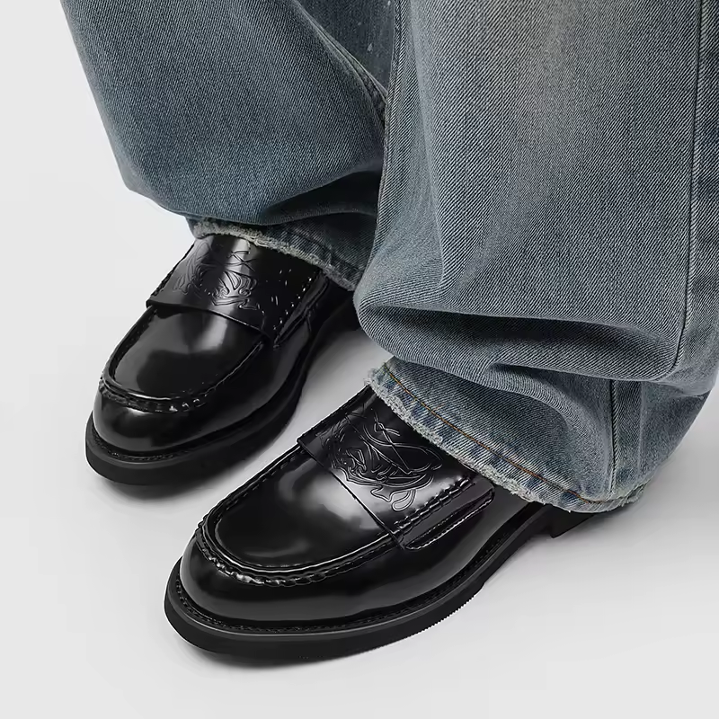 Versatile black men's slip-on loafers for a classic look, suitable as formal dress shoes or business casual footwear.