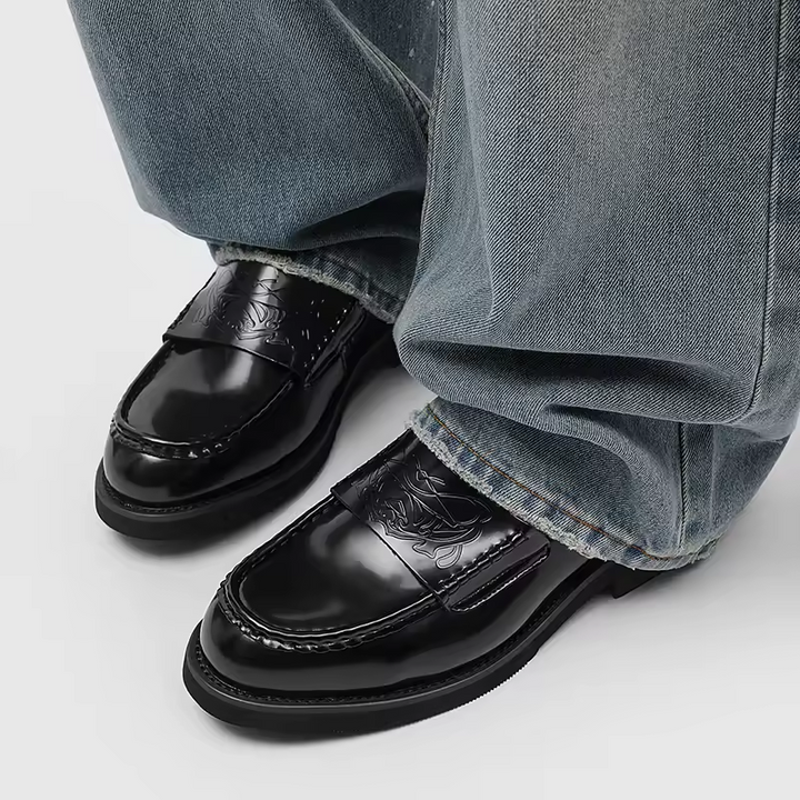 Versatile black men's slip-on loafers for a classic look, suitable as formal dress shoes or business casual footwear.