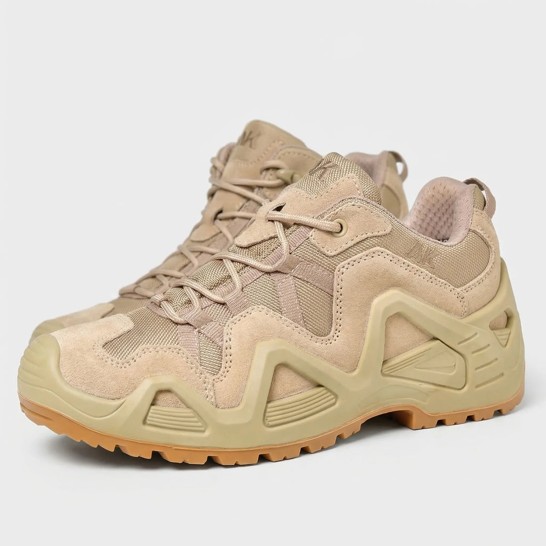 Durable all-terrain sole of black men's tactical boots, showing deep tread for maximum grip on trails.