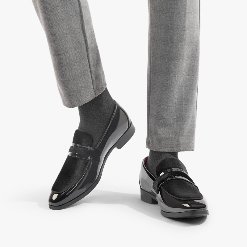 Pair of elegant men's navy slip-on dress shoes. Stylish formal footwear for office or evening.