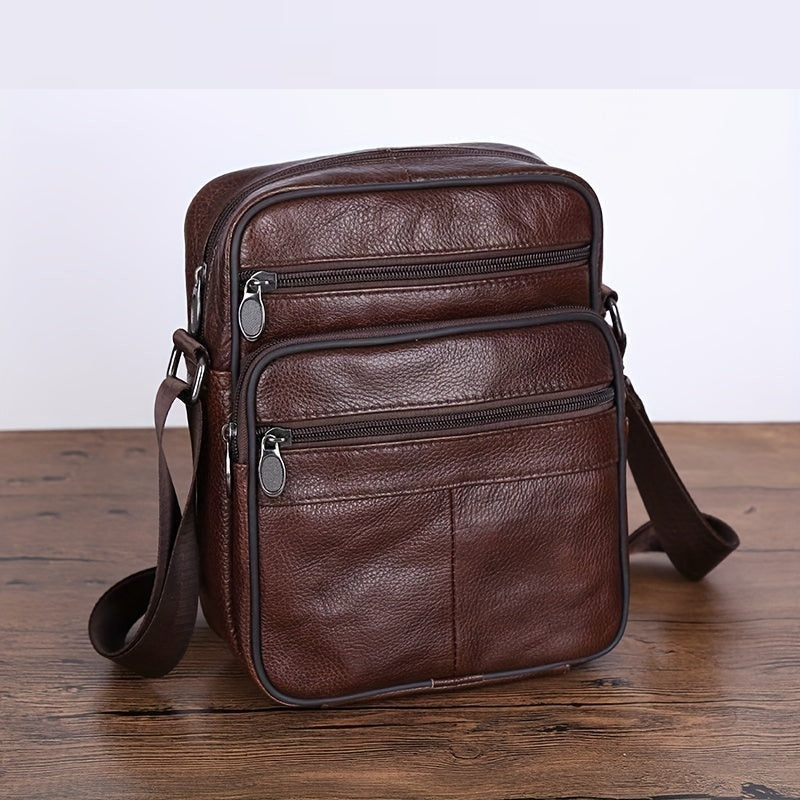 Compact men's everyday carry bag, black, featuring an adjustable crossbody strap.