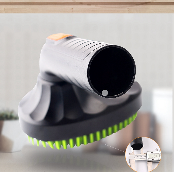 Grooming accessory: black vacuum attachment with silicone bristles, ideal for pet hair removal from surfaces.