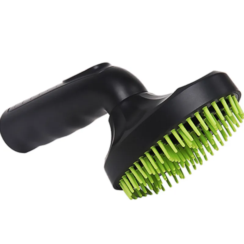 Hand holding a black pet hair vacuum attachment, demonstrating its ergonomic design for home cleaning.