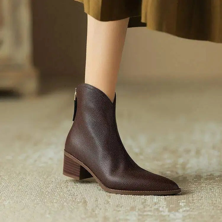 Black pointed toe women's ankle boots, slip-on with low heel. Ideal for office & versatile everyday chic.