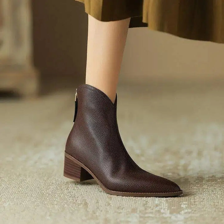 Black pointed toe women's ankle boots, slip-on with low heel. Ideal for office & versatile everyday chic.