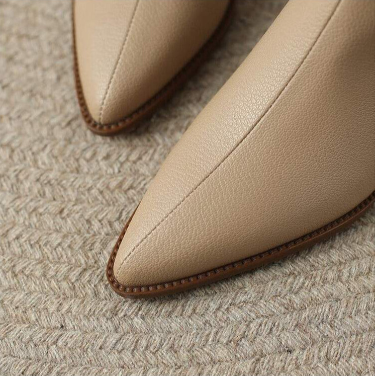 Versatile women's slip-on pointed toe ankle boots with pants. Great for chic fall, winter & everyday outfits.