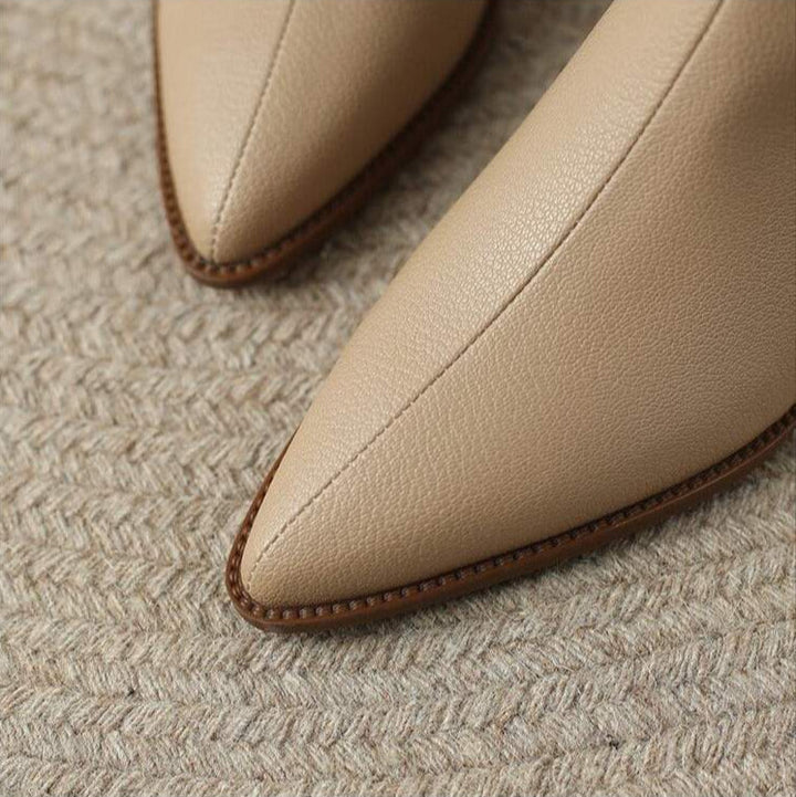 Versatile women's slip-on pointed toe ankle boots with pants. Great for chic fall, winter & everyday outfits.