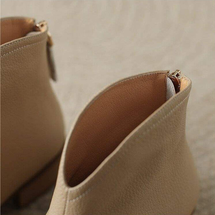 Stylish women's low heel pointed toe slip-on ankle boots. Comfortable, versatile for office, fall & winter.